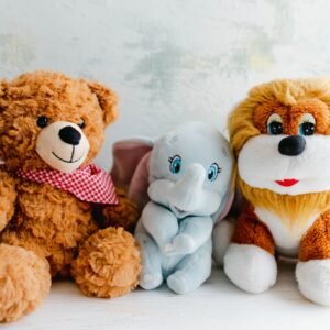 Adorable plush toys featuring a teddy bear, lion, and elephant perfect for children's gifts or decor.